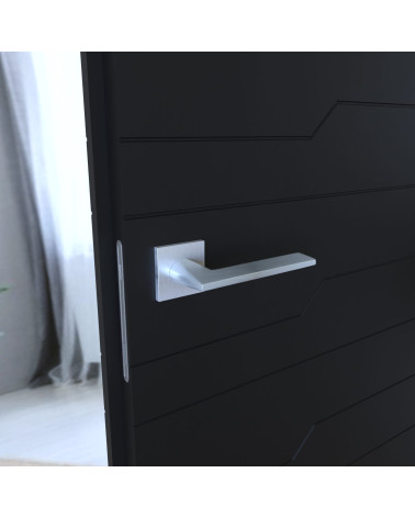Poignée de porte minimaliste ARA poignée design montée sur une porte entrouverte