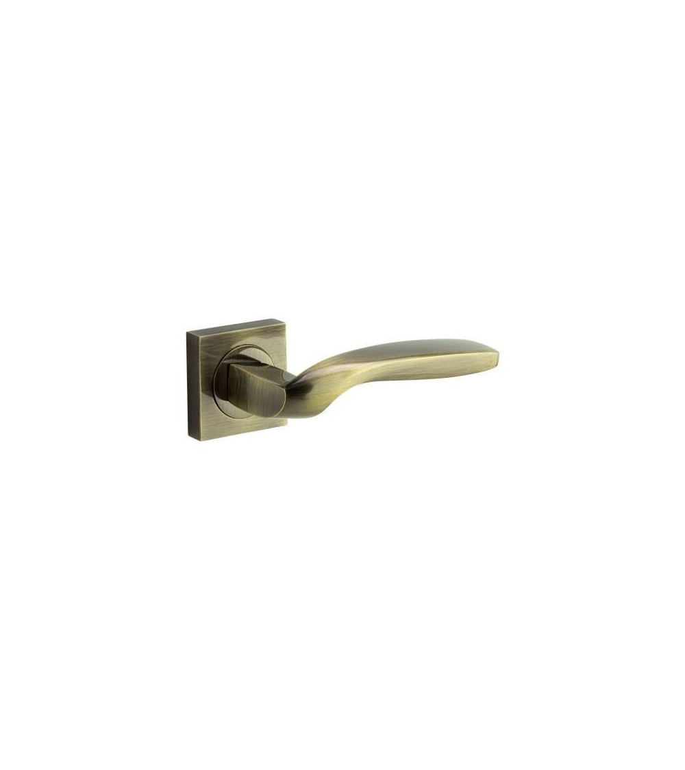 Atypical door handle in polished brass finish, a modern and elegant design