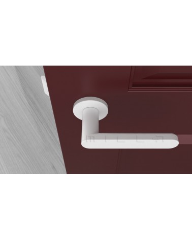 Poignée de porte coloris blanche ALORA poignée design vue de haut montée sur une porte