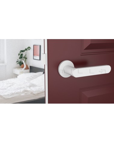 Poignée de porte coloris blanche ALORA poignée design vue de bas montée sur une porte