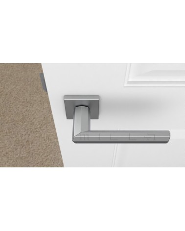 Poignée de porte chrome satiné FRESIA poignée design vue de haut montée sur une porte
