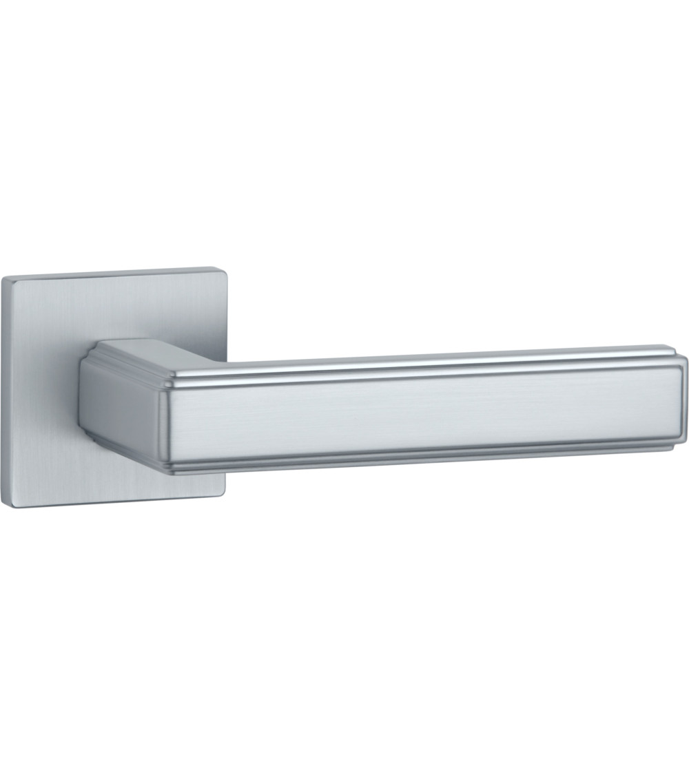 original door handle in satin chrome on a square backplate presented on a white background