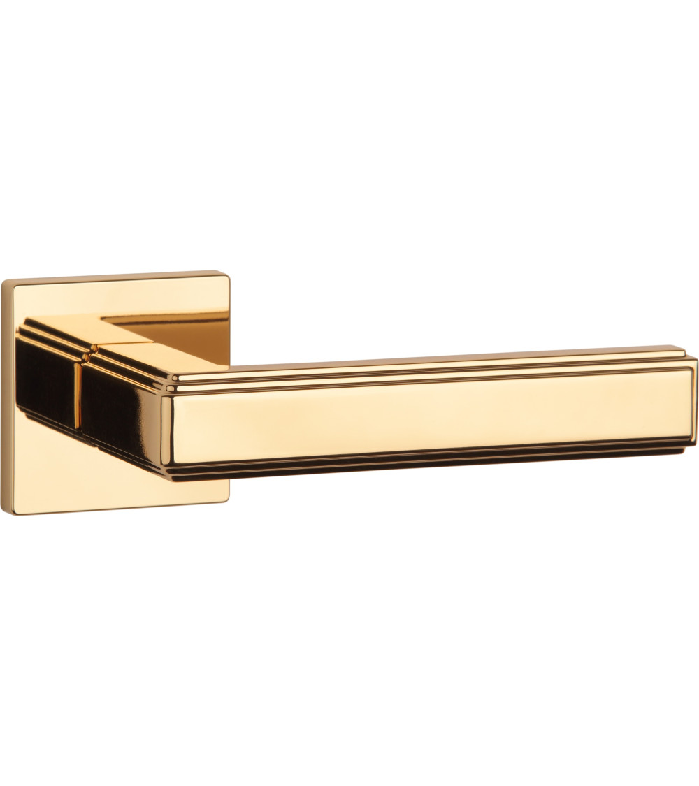 designer interior handle in polished gold on square plate
