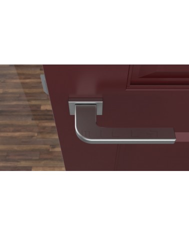 Poignée de porte chrome satiné ISMENA quincaillerie design vue de haut montée sur une porte