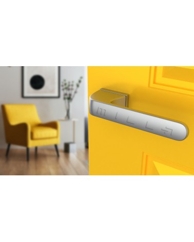 Poignée de porte PLUMERIA poignée design couleur 2 vue de haut inclinée montée sur une porte