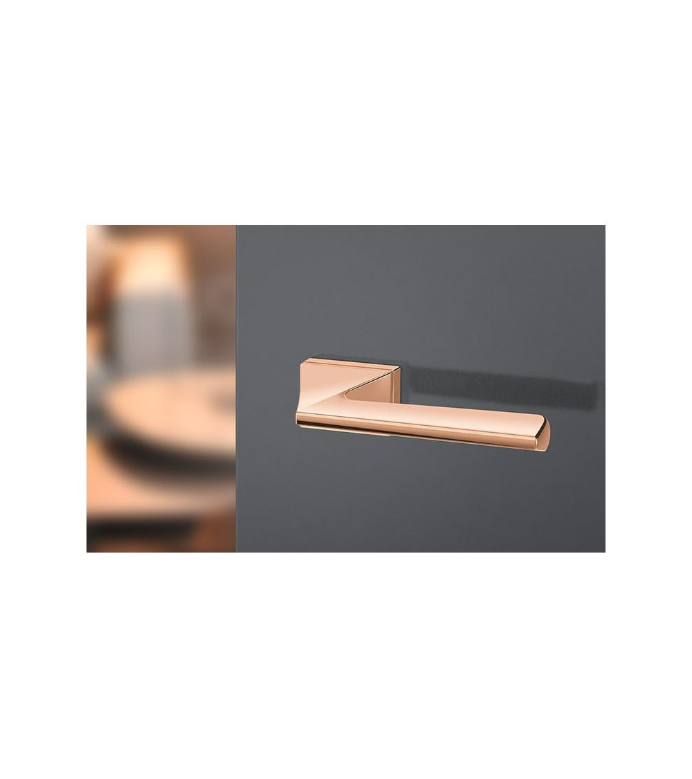 Very beautiful copper-coloured handle on a grey door - ideal for bedrooms