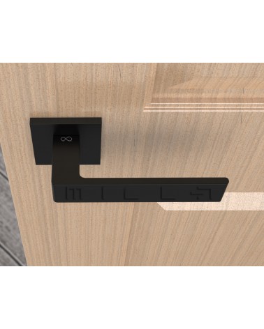 Poignée de porte noire Apollo poignée design vue de haut montée sur une porte