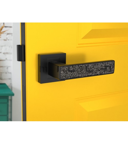 Poignée de porte noire GLAMOUR quincaillerie design vue de haut montée sur une porte