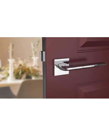Poignée de porte en zamak LUNARIA poignée design couleur 2 vue de face montée sur une porte