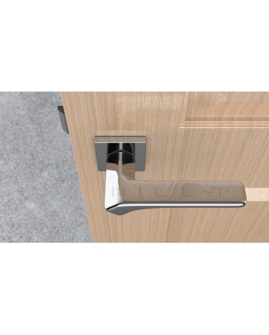Poignée de porte en zamak BERGERIA poignée design vue de haut montée sur une porte