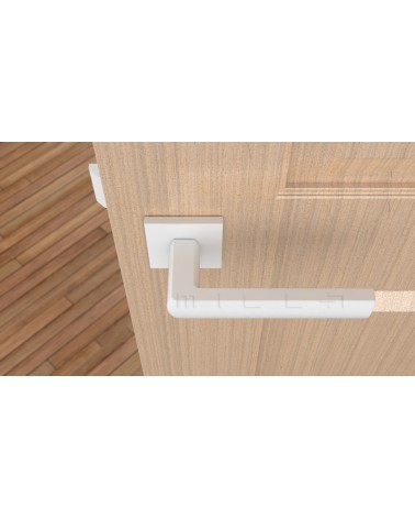 Poignée de porte en zamak HOSTA poignée design vue de haut montée sur une porte
