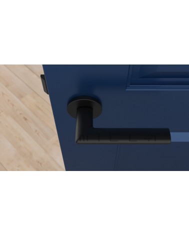 Poignée de porte en zamak KALMIA poignée design vue de haut montée sur une porte