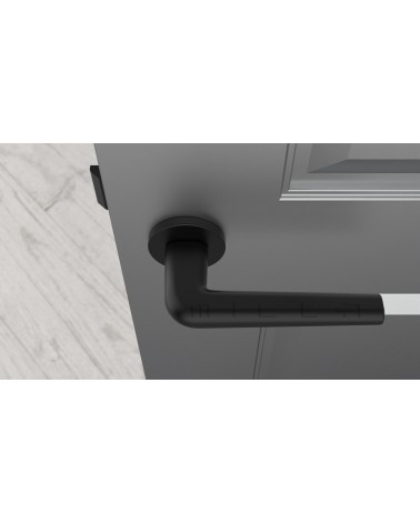 Poignée de porte en zamak FUNKIA poignée design vue de haut montée sur une porte