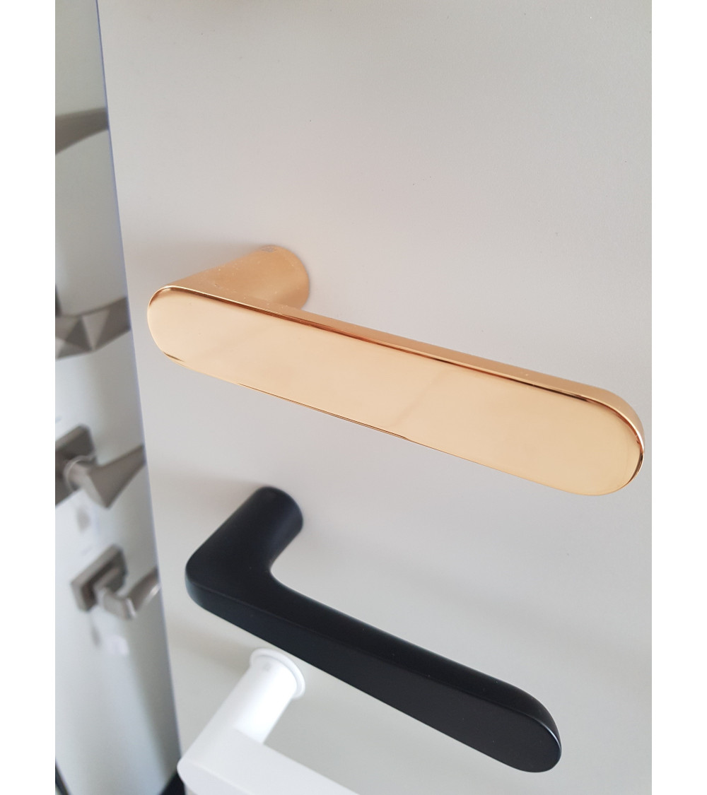 avant-garde door handle in gold finish
