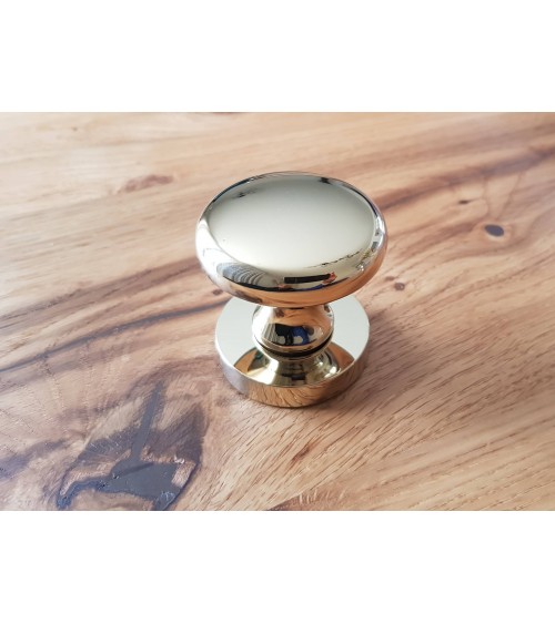 Orbis door knob in a retro style offered in the polished brass version