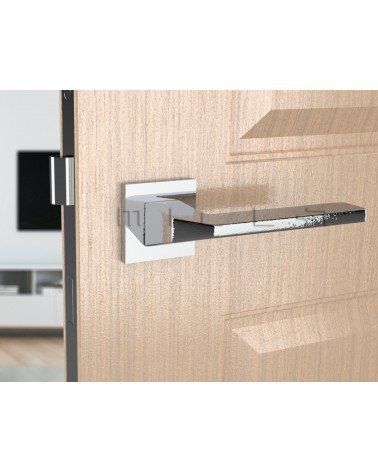 Poignée de porte en zamak ETNA quincaillerie design couleur 2 vue de face montée sur une porte
