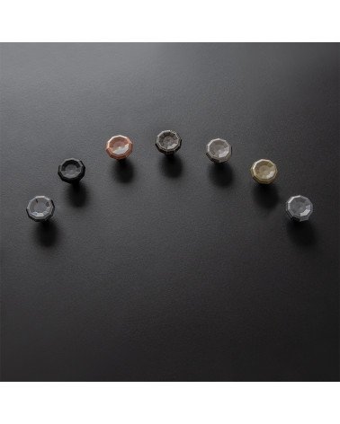 Bouton de meuble CAMPANA poignée design disposés en arc de cercle sur une surface noire