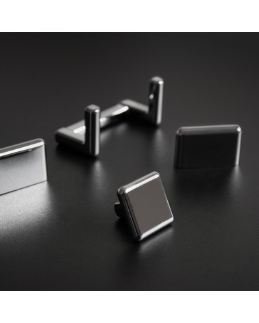 Bouton de meuble titane NOX poignée design présenté sur un surface sombre