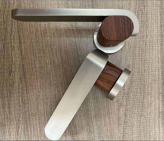 A two-tone interior designer handle with a wood-effect and satin nickel finish to complement your wood-effect doors and your décor