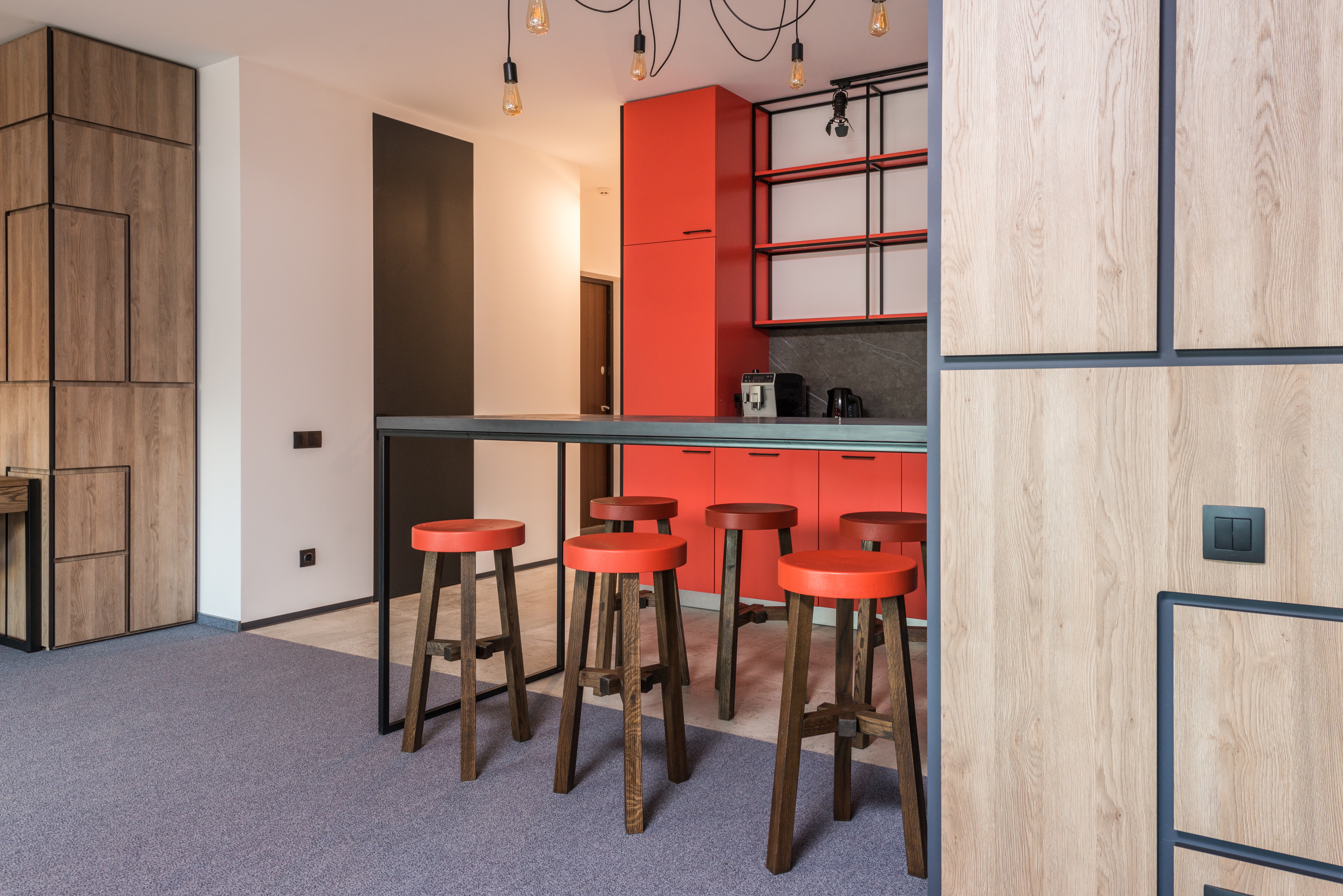 A kitchen mixing red and wood to match your red door handles