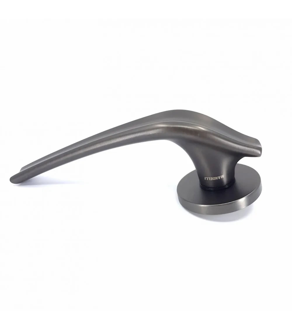 Original door handle with the slender and graceful shape of a dolphin