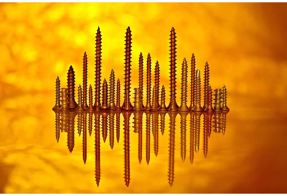 Vis traversantes longues : la solution de quincaillerie pour poignées de porte épaisse